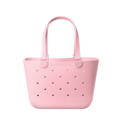 Soft pale pink tote bag with mauve perforated detailing across the front for subtle contrast