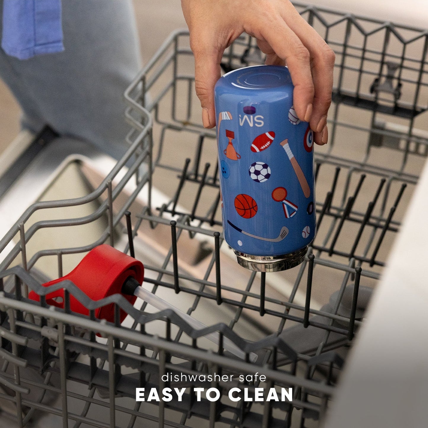 Hand holding a periwinkle blue SM Summit 2.0 water bottle with sports print design inside an open dishwasher. Text reads "dishwasher safe" and "EASY TO CLEAN."