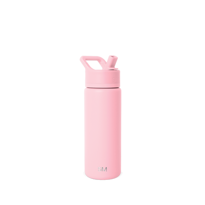 Soft pastel pink water bottle against a light gray background