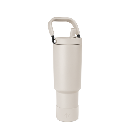 Off-white cream portable storage product with matte black carrying handle and metallic silver hardware details